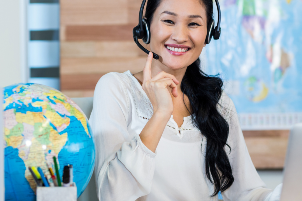 Stock image - woman on headset with maps - DMO agency representation