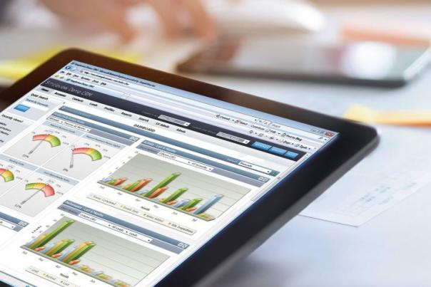 Simpleview CRM is visible on an iPad at a conference table