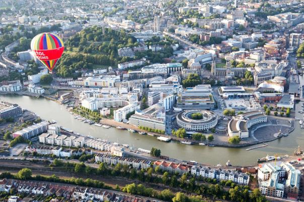 Hot air balloons fly over Bristol harbourside in Bristol, England.