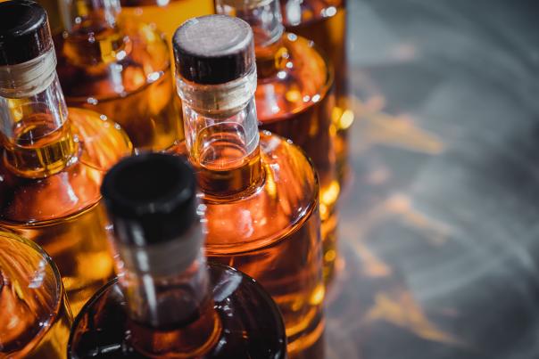 Bottles of liquor from a distillery getting prepared to ship.