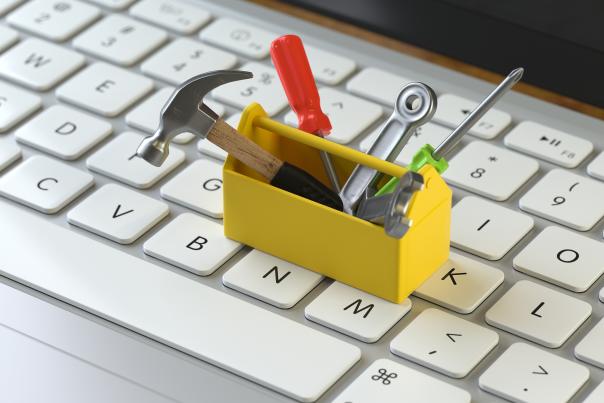 tools on the keyboard of a laptop