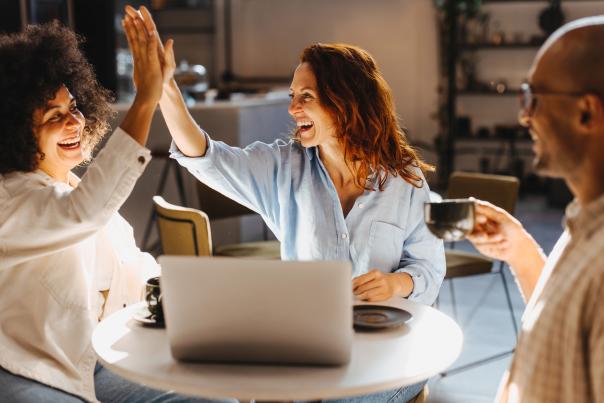 Two women high five