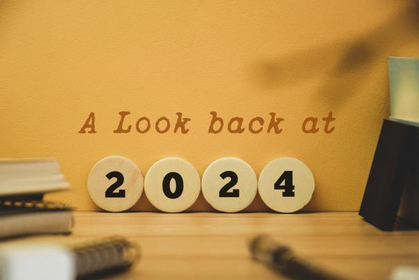 Wooden circles with numbers to spell out the year 2024.