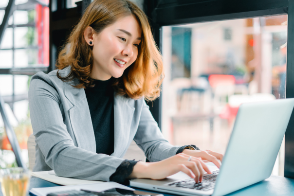 Woman at desk working on a laptop