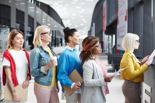 Women waiting in line at conference center