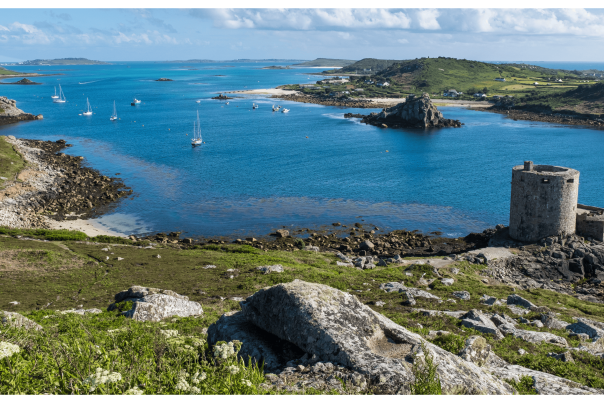 Boats sit in a cove in the Isles of Scilly.