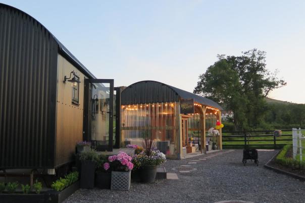 Fairy-lit glamping accommodation at sunset in Fermanagh, Northern Ireland
