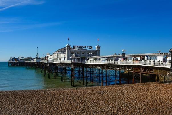 A view of Brighton Pier in Brighton, England on a sunny day.