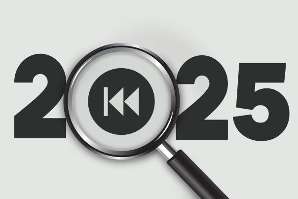 The year 2025 written out with a magnifying glass and rewind symbol over where the zero would be.