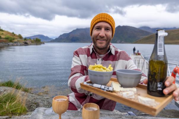 A man eating a plate of food in Norway's Lofoten Archipelago
