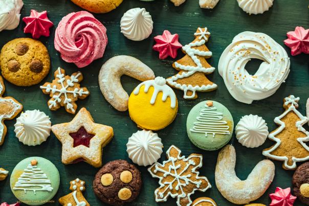 A colourful selection of Christmas cookies against a dark background
