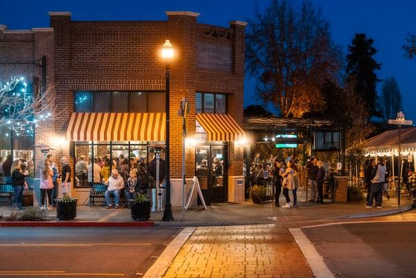 Arroyo Grande Rooster Creek Tavern at Night with people walking around