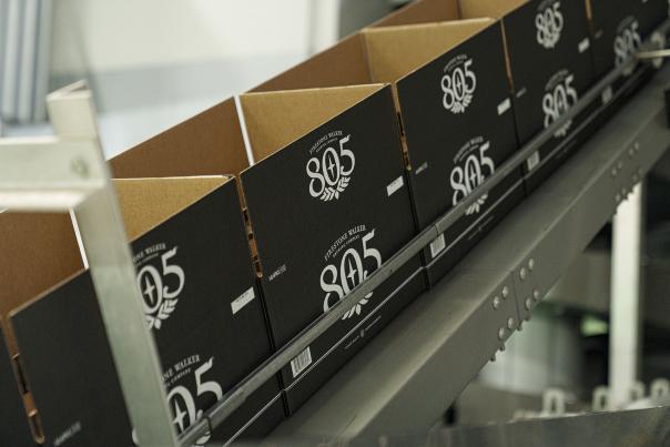 Boxes on assembly line with 805 printed on them
