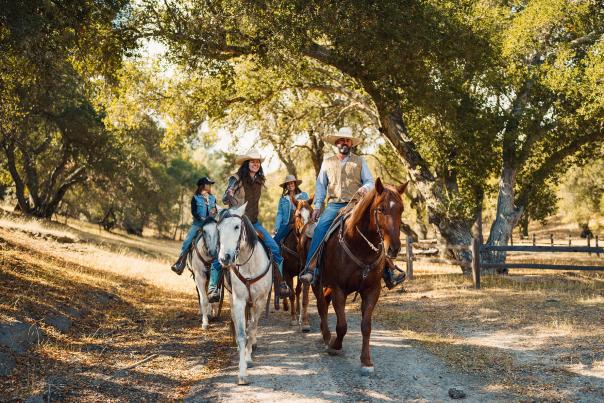 group horseback riding on a trail in Santa Margarita