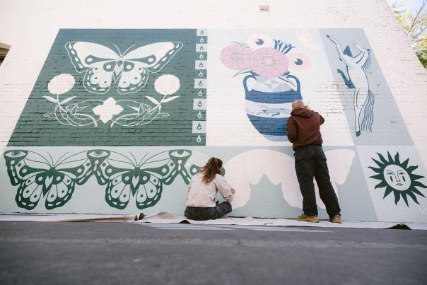 Canned Pineapple Co painting mural in Downtown SLO