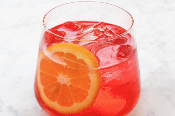 Sonoma Valley Spritz Week red cocktail with an orange