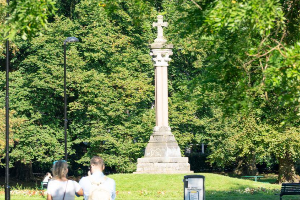 Couple walking in Queens Park banner
