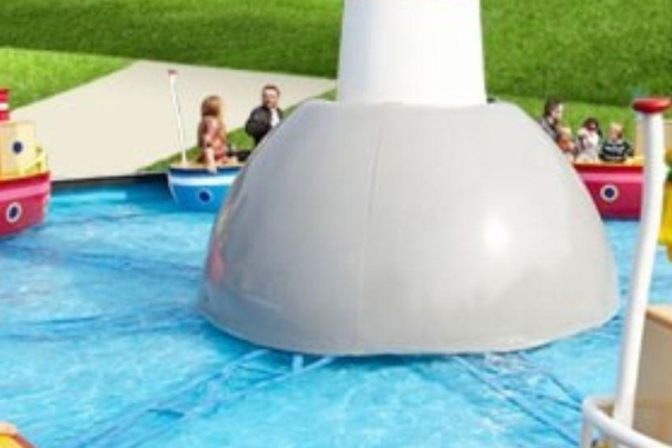 Families enjoying a relaxing childrens boat ride in Paultons Park