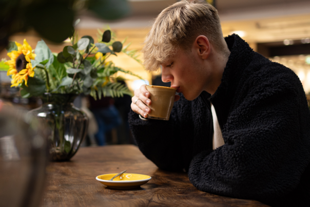 Person sipping coffee Mettricks Westquay