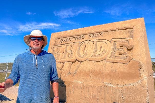 David Ducharme sculpts a photo opportunity out of sand for Atlantis Rising