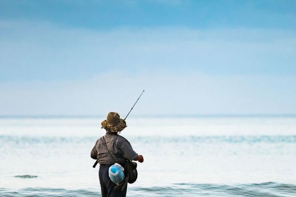 person-fishing-at-the-beach-2110x2344-1