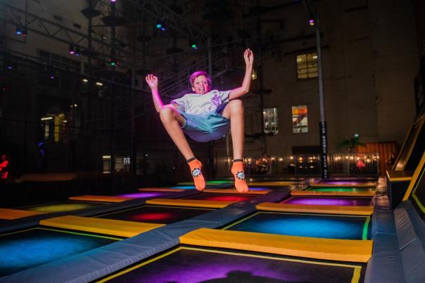 boy jumping on trampoline