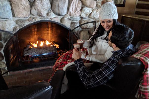 Couple by the fireplace