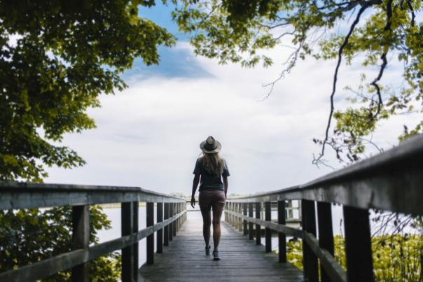 Woman walking on boardwalk