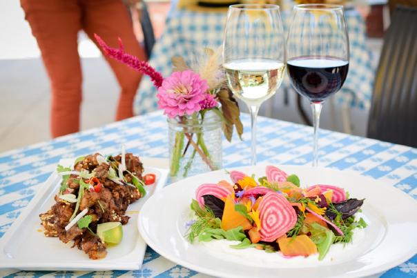Salad, Chicken and Wine on a table