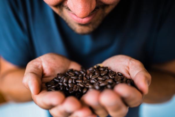Man Holding coffee beans