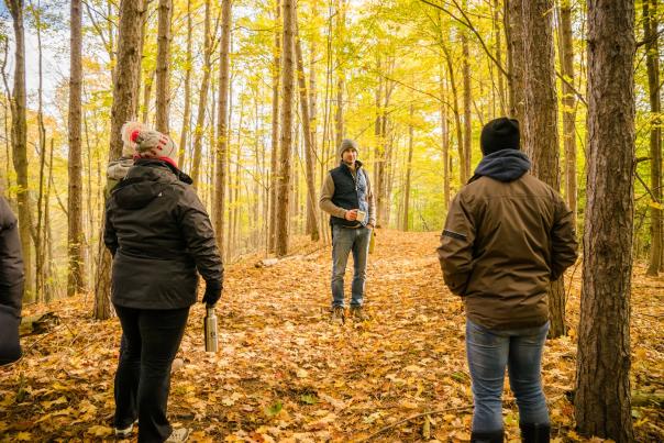 3 people in the woods