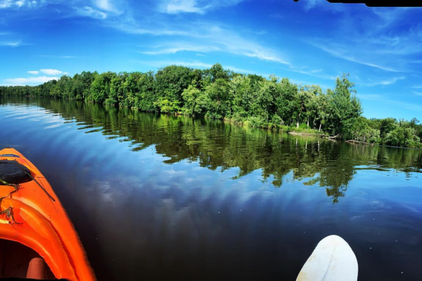 A kayaker paddles through an intersection of the Wisconsin River.
