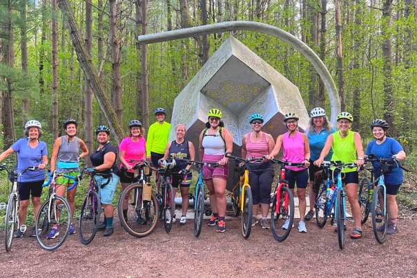 Female centered biking group, Girls on Gravel, biking at the Stevens Point Sculpture Park.