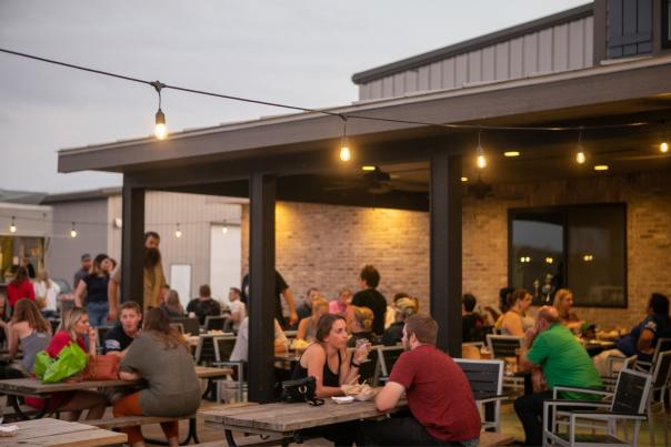 Guests gather outside at Central Waters Brewery.