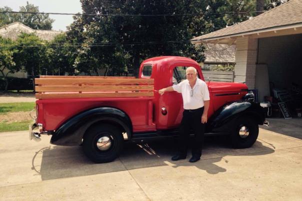 Ray Pellerin next to red truck