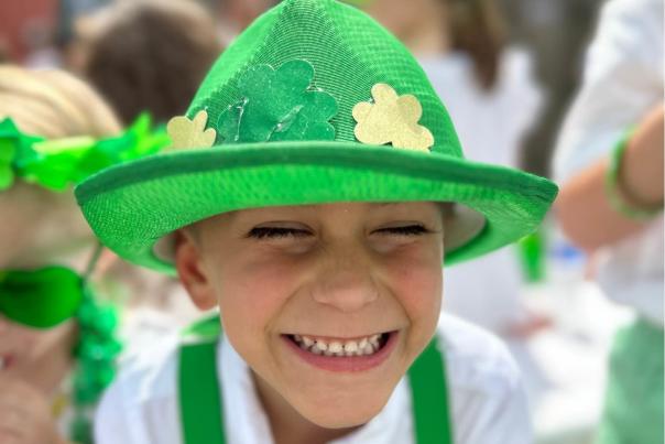 A child smiles for the camera at the Covington Celtic Club's annual St. Patrick's Day Parade.