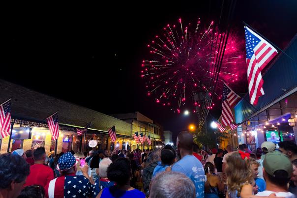 Fireworks light up the sky over a crowd in Olde Towne Slidell for 4th of July celebration, 2024.