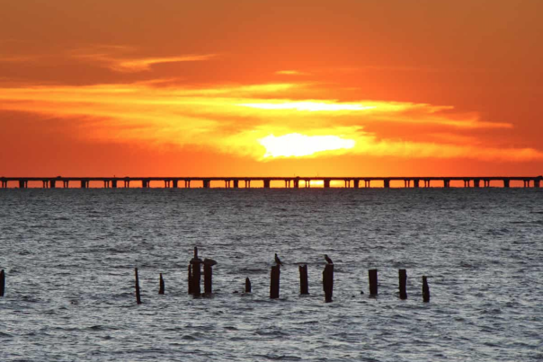 The sun sets on Lake Pontchartrain Causeway. This bridge has the potential to produce a state record trout on any given day.