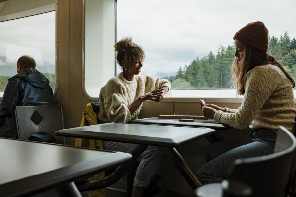 Two women playing cards on a BC Ferries vessel.