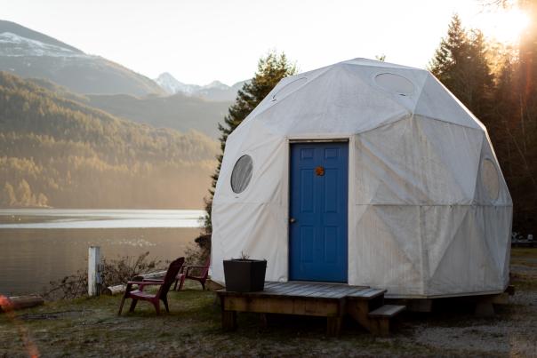 An exterier view of a geodesic glamping dome.