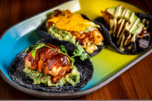 Puesto Huntington Beach. Three Tacos on a dish