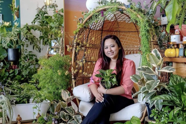 House Plant Nation. Tammy Ha the owner surrounded by plants