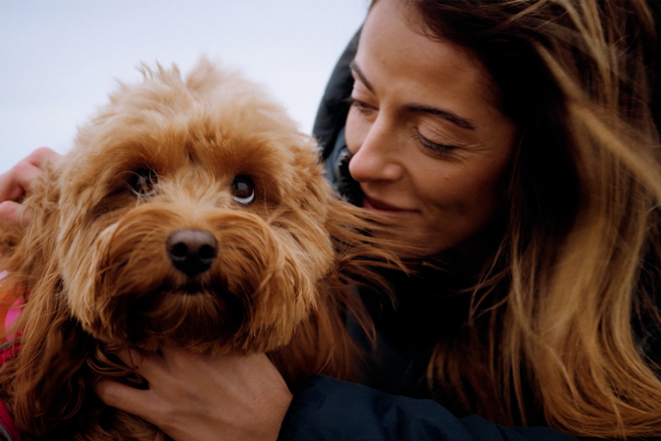 A woman hugging a dog