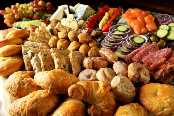 A table of pastries, cheese and meat