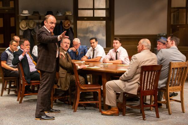 12 men at a table from the Syracuse Stage production of 12 Angry Men