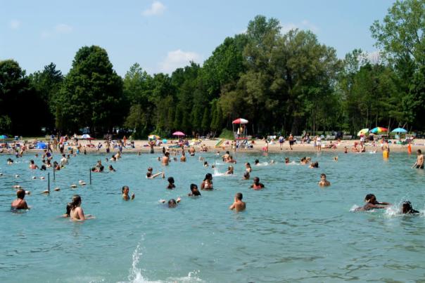 crowd of people swimming at green lakes