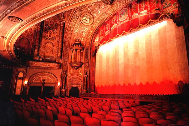 Red Tinted Photo of Historic Landmark Theater Stage and Seating