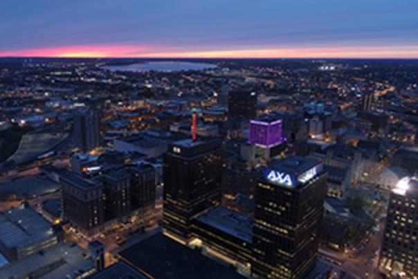 Skyline of Syracuse showing downtown and lake at dusk