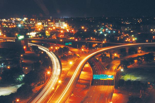 Night-time Photo of CNY Highways and Bright City Lights