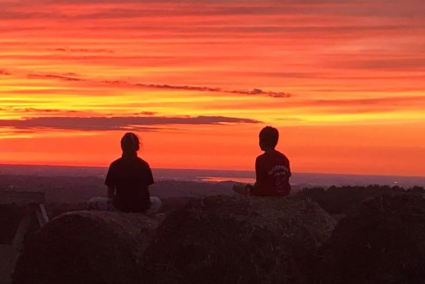 two kids watching sunset at heritage hill